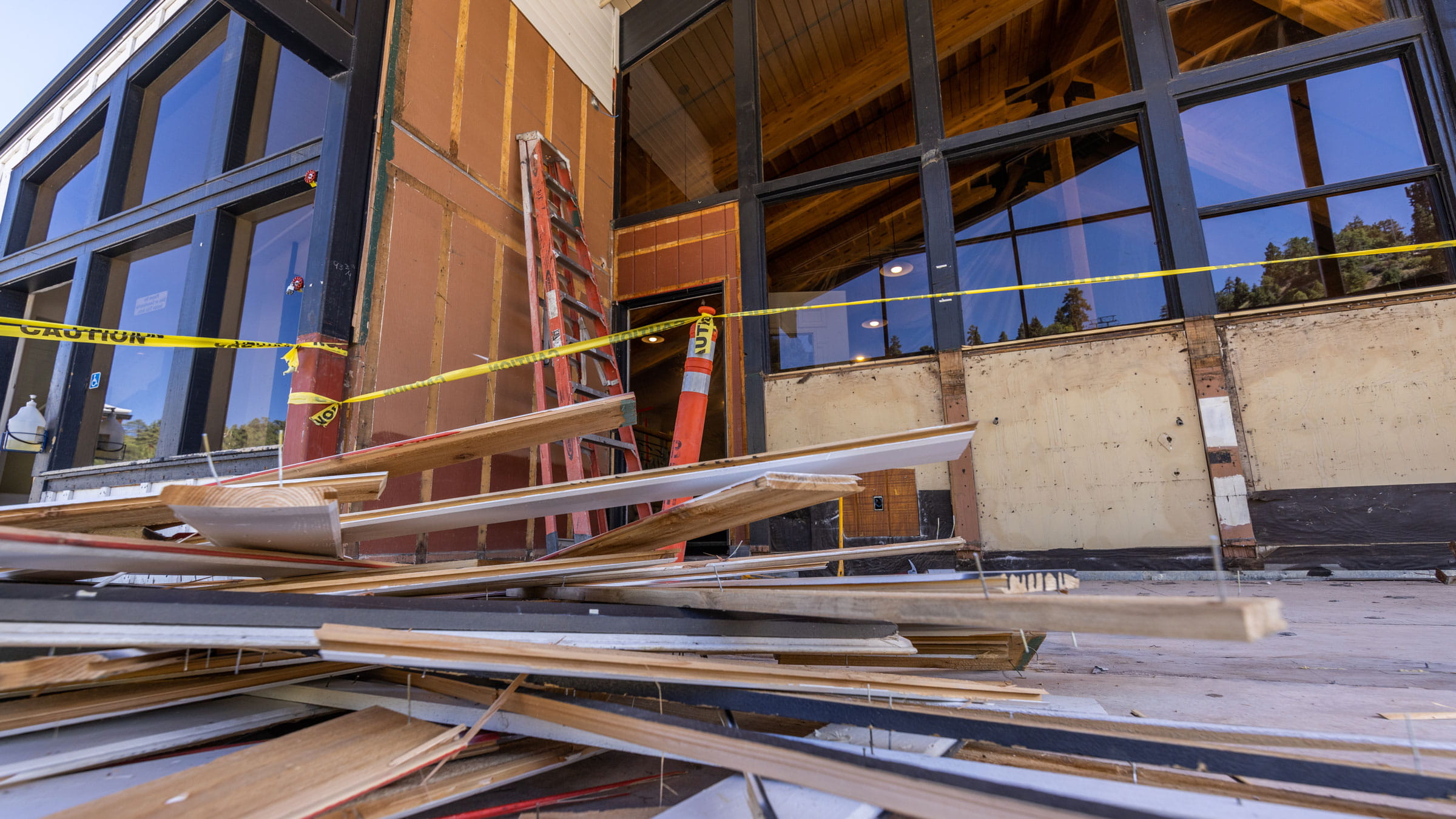 Outside deck of laybacks bar being remodeled, wood on the ground